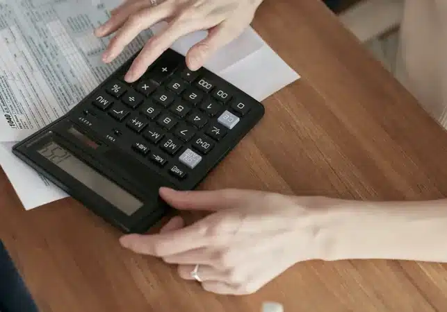 a person calculating their cost of living in Portugal