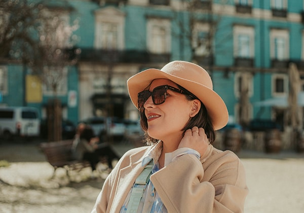 a woman with a hat moving to Portugal 