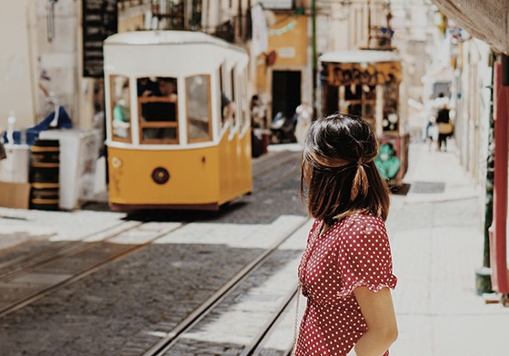 A woman using public transportation in Lisbon